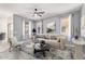 Bright living room featuring light gray walls, modern furnishings, and neutral decor at 29109 N Fire Agate Rd, San Tan Valley, AZ 85143