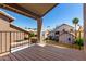 Balcony with wooden deck overlooking nearby homes and blue sky at 3165 W Golden Ln, Chandler, AZ 85226
