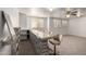 Finished basement with a brick bar and multiple chairs, great for entertaining guests at 3165 W Golden Ln, Chandler, AZ 85226