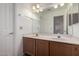 Bathroom featuring a double vanity and large mirror at 3165 W Golden Ln, Chandler, AZ 85226