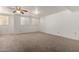 Large bedroom with carpet, multiple windows with blinds and ceiling fan at 3165 W Golden Ln, Chandler, AZ 85226