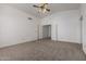 The primary bedroom features a ceiling fan and access to the bathroom through double doors at 3165 W Golden Ln, Chandler, AZ 85226