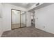 Bedroom includes mirrored closet doors, and a ceiling fan, and offers access to the bar area at 3165 W Golden Ln, Chandler, AZ 85226
