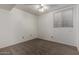 Clean guest bedroom with wall-to-wall carpet, a ceiling fan, and one window at 3165 W Golden Ln, Chandler, AZ 85226
