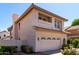 View of a two-story home, showing landscaping, a tiled roof and an attached two-car garage at 3165 W Golden Ln, Chandler, AZ 85226