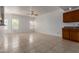 Spacious living room with tile flooring, ceiling fan, and plenty of natural light from large windows at 3165 W Golden Ln, Chandler, AZ 85226