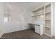 Carpeted loft space with built-in shelving and desk area at 3165 W Golden Ln, Chandler, AZ 85226