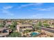 Aerial view of a beautiful home with a private pool, lush landscaping, and scenic neighborhood views at 3169 E Eleana Ln, Gilbert, AZ 85298