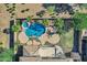 Aerial shot of a backyard oasis featuring a custom pool, spa, and lush landscaping at 3169 E Eleana Ln, Gilbert, AZ 85298