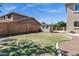 The home has a large backyard with a shed, a grassy area, and a concrete curb at 3169 E Eleana Ln, Gilbert, AZ 85298
