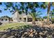 An entertainer's backyard featuring mature landscaping, a pool, and a covered patio area at 3169 E Eleana Ln, Gilbert, AZ 85298