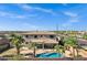 Beautiful home featuring a private backyard oasis with a pool, patio, and lush tropical landscaping at 3169 E Eleana Ln, Gilbert, AZ 85298