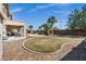 This spacious backyard features mature landscaping, gravel, and a covered patio area for entertaining at 3169 E Eleana Ln, Gilbert, AZ 85298