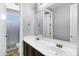 Bathroom featuring double sinks, a large mirror, and a separate shower and toilet area at 3169 E Eleana Ln, Gilbert, AZ 85298