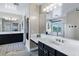 Lavish bathroom with double sinks, large mirrors, and a tub with window view at 3169 E Eleana Ln, Gilbert, AZ 85298