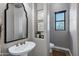 Powder room features modern fixtures and a dedicated water closet with a window at 3169 E Eleana Ln, Gilbert, AZ 85298
