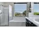 Beautiful bathroom featuring a shower, soaking tub, large window, and sleek vanity at 3169 E Eleana Ln, Gilbert, AZ 85298
