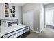 Cozy bedroom featuring a metal frame bed, carpet floors, and a closet with sliding doors at 3169 E Eleana Ln, Gilbert, AZ 85298