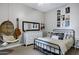 Bedroom features a bed, white dresser, hanging chair and music-themed decor at 3169 E Eleana Ln, Gilbert, AZ 85298