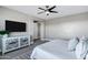 Spacious bedroom featuring a TV, modern decor, and a comfortable, inviting bed at 3169 E Eleana Ln, Gilbert, AZ 85298
