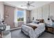 Charming bedroom with a ceiling fan, large window with view, and stylish decor at 3169 E Eleana Ln, Gilbert, AZ 85298