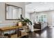 Elegant entryway features hardwood floors, console table, and mirror, leading into a bright, open living space at 3169 E Eleana Ln, Gilbert, AZ 85298