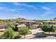 Stunning two-story home with a well-manicured lawn, mature trees, and a spacious driveway at 3169 E Eleana Ln, Gilbert, AZ 85298