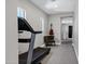 Hallway with a treadmill, chair, and guitar, with access to other rooms at 3169 E Eleana Ln, Gilbert, AZ 85298