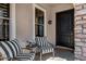 Welcoming front porch seating area to enjoy the outdoors, protected by a charming archway at 3169 E Eleana Ln, Gilbert, AZ 85298