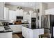 Modern kitchen featuring white cabinets, stainless steel appliances, and a center island with pendant lighting at 3169 E Eleana Ln, Gilbert, AZ 85298