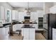 Well-appointed kitchen features white cabinetry, stainless steel appliances, and a center island at 3169 E Eleana Ln, Gilbert, AZ 85298