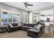 Bright living room with a comfortable sectional sofa, large windows, and access to the backyard pool at 3169 E Eleana Ln, Gilbert, AZ 85298