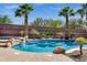 This backyard features a pool with mature landscaping, and a boulder accent at 3169 E Eleana Ln, Gilbert, AZ 85298