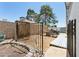 Fenced-in backyard with stone pavers, mature shade trees, and an RV trailer at 3736 W Angela Dr, Glendale, AZ 85308