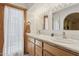 Bathroom with double vanity, marble countertop, and natural lighting at 3736 W Angela Dr, Glendale, AZ 85308