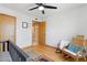 Upstairs bedroom with a rocking chair and doorway at 3736 W Angela Dr, Glendale, AZ 85308