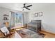 Cozy Bedroom with soft lighting, rocking chair and crib at 3736 W Angela Dr, Glendale, AZ 85308