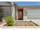 Welcoming front entrance with a decorative wooden door and a brick facade at 3736 W Angela Dr, Glendale, AZ 85308