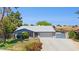 Charming single-Gathering home featuring a two-car garage, well-maintained lawn and mature landscaping at 3736 W Angela Dr, Glendale, AZ 85308