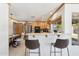 Spacious kitchen with stainless steel appliances, granite countertops, and bar seating at 3736 W Angela Dr, Glendale, AZ 85308