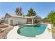 Backyard pool with steps, concrete decking and patio area for relaxing and entertaining at 3736 W Angela Dr, Glendale, AZ 85308