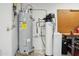 Utility room with AO Smith water heater and water filtration system at 3736 W Angela Dr, Glendale, AZ 85308