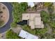 An aerial view shows the layout of the home with a private driveway and mature landscaping at 39016 N Habitat Cir, Cave Creek, AZ 85331