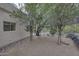 Backyard is landscaped with native plants and features a wall at 39016 N Habitat Cir, Cave Creek, AZ 85331