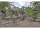 View of the backyard with native landscaping and desert foliage enhances privacy at 39016 N Habitat Cir, Cave Creek, AZ 85331