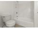 Clean, white bathroom with shower and bath combination with a white toilet at 39016 N Habitat Cir, Cave Creek, AZ 85331