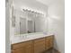 This double sink vanity features a large mirror and plenty of lighting at 39016 N Habitat Cir, Cave Creek, AZ 85331