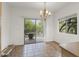 Cozy dining area with tiled floors, patio access, and ample light for a welcoming dining experience at 39016 N Habitat Cir, Cave Creek, AZ 85331