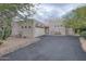 Charming single-story home with a desert landscape and a private driveway at 39016 N Habitat Cir, Cave Creek, AZ 85331