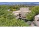 Attractive property with desert landscaping, a private drive, and mountain views in the background at 39016 N Habitat Cir, Cave Creek, AZ 85331